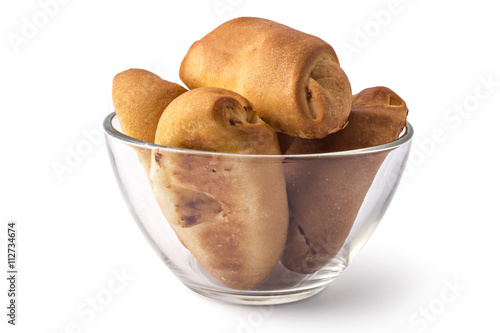 Fresh bavarian pastries rolls, kifla kiflice, in the glass bowl, isolated on white background photo