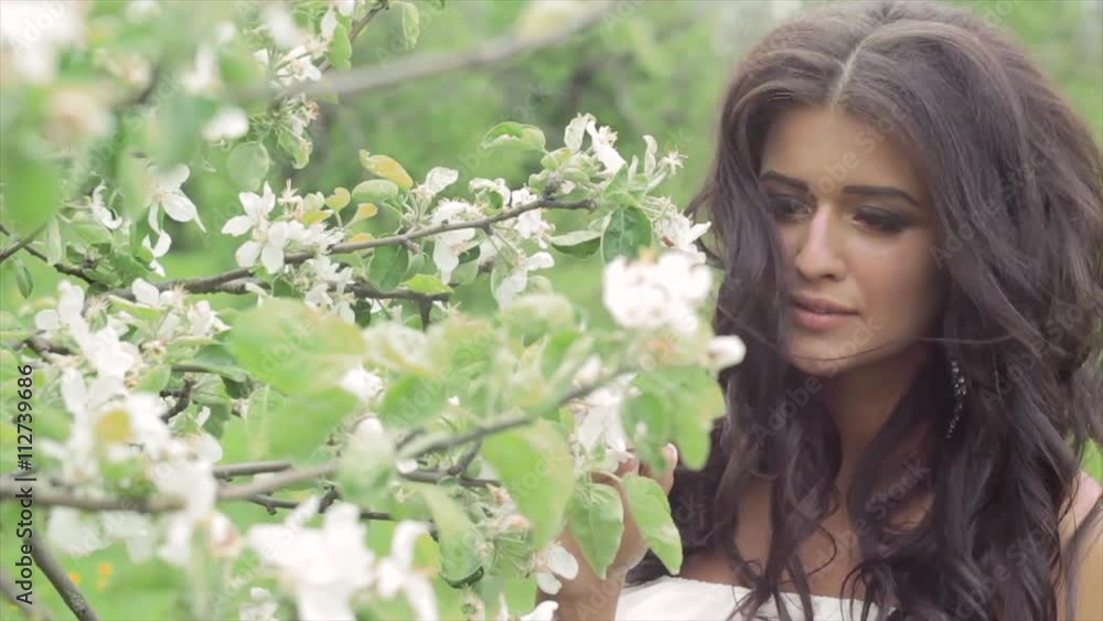 A beautiful dark-skinned woman in a white dress A beautiful dark-skinned woman in a white dress