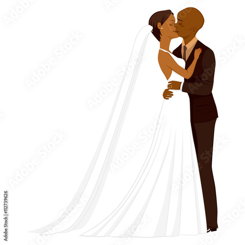Beautiful young African American couple tenderly kissing on their wedding day
