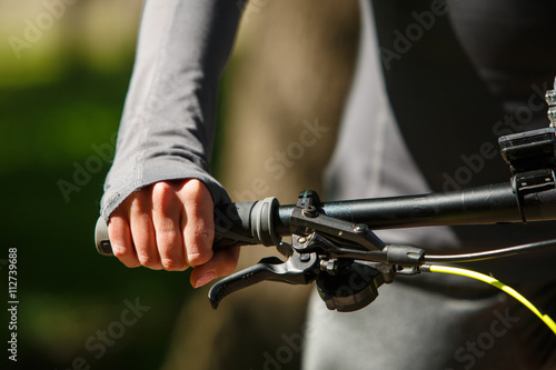 Woman hands on modern sport bike photo
