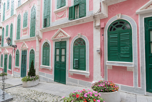 The traditional quaint houses in pink Portugal style and vintage.