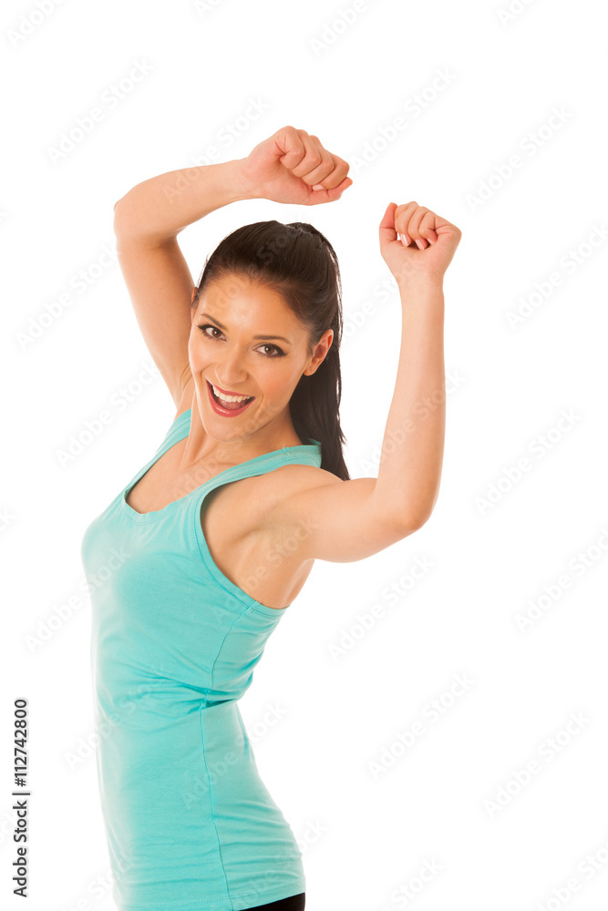 Happy fit and slim woman dancing and jumping isolated over white