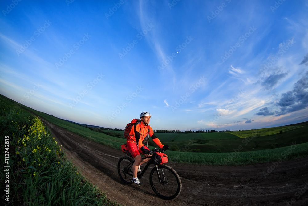 Young man is riding bicycle outside. Healthy Lifestyle.