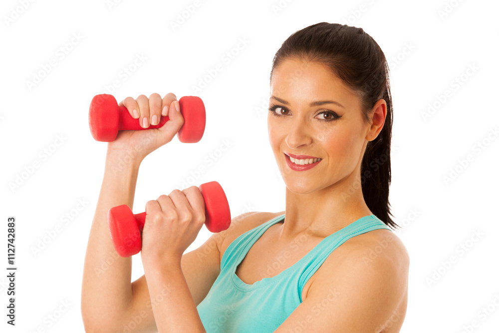 active woman with dumbbells workout in fitness gym isolated over active woman with dumbbells workout in fitness gym isolated over
