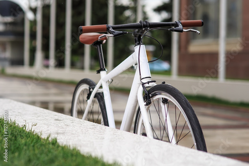 white fixed-gear bicycle on street