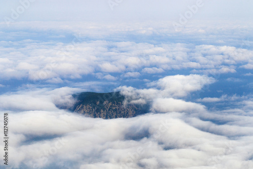Top of mountains in clouds