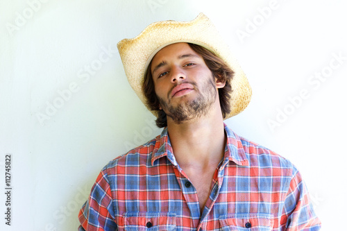 Rugged young man wearing cowboy hat