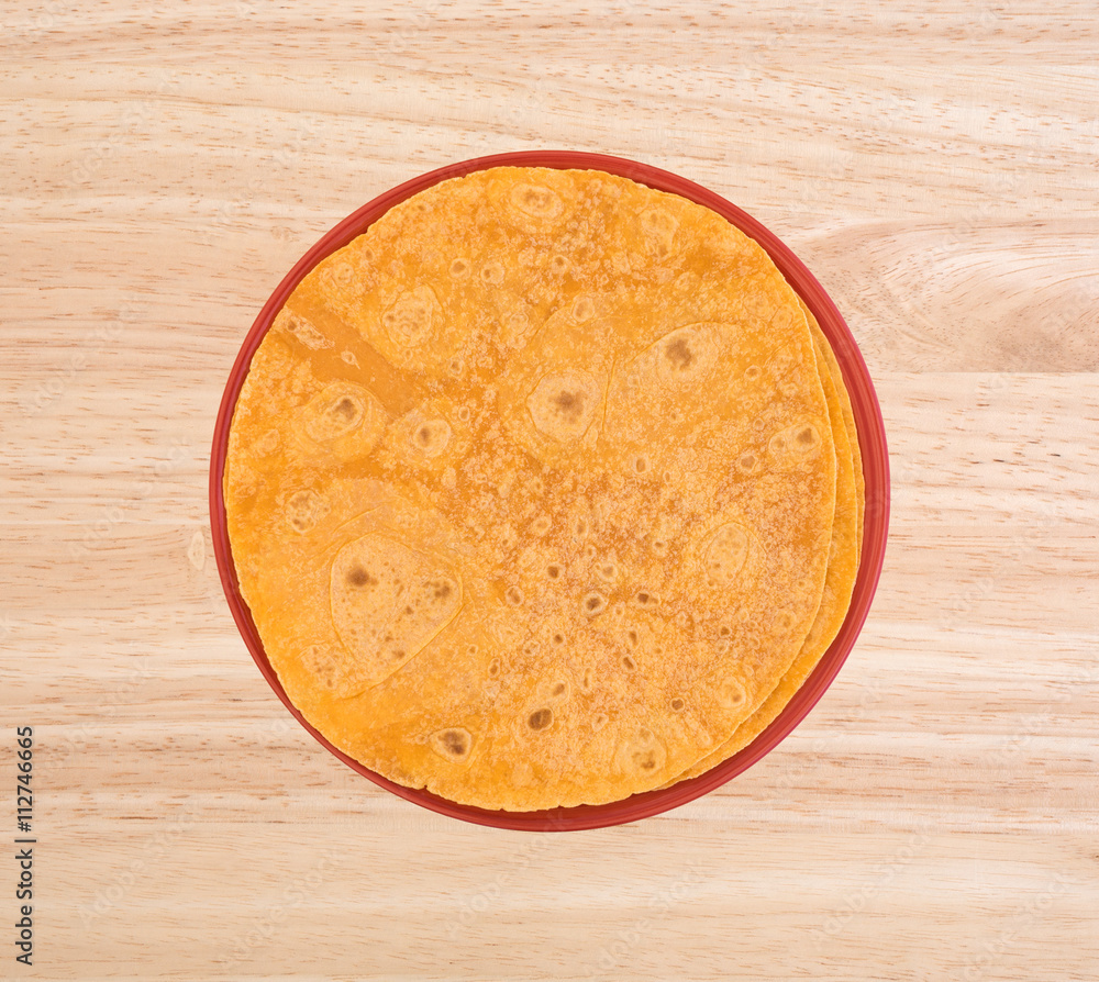 Plate of tomato tortilla wraps on a table top Plate of tomato tortilla wraps on a table top