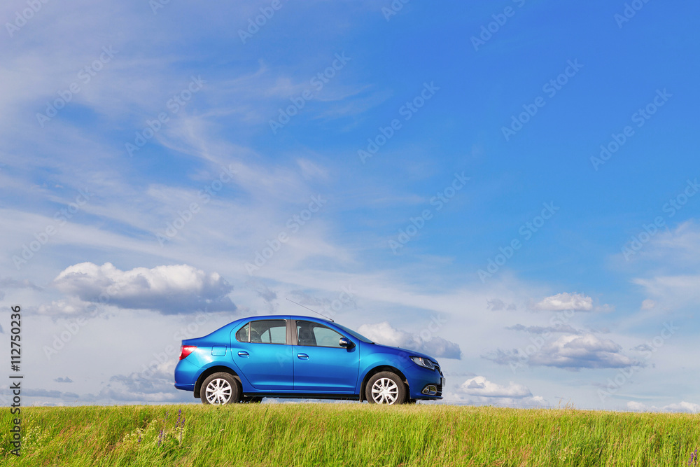 New car parked by the side of a lonely road in rural