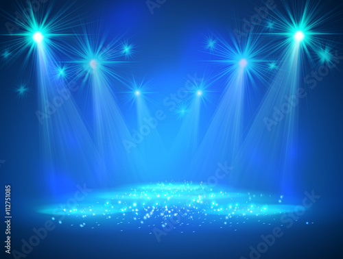 Spotlight on stage with smoke and light.
