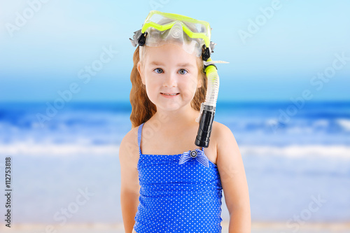 Happy little girl in blue s...