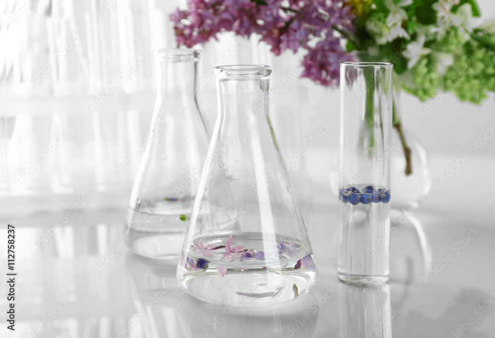 Flowers in test tubes on the table