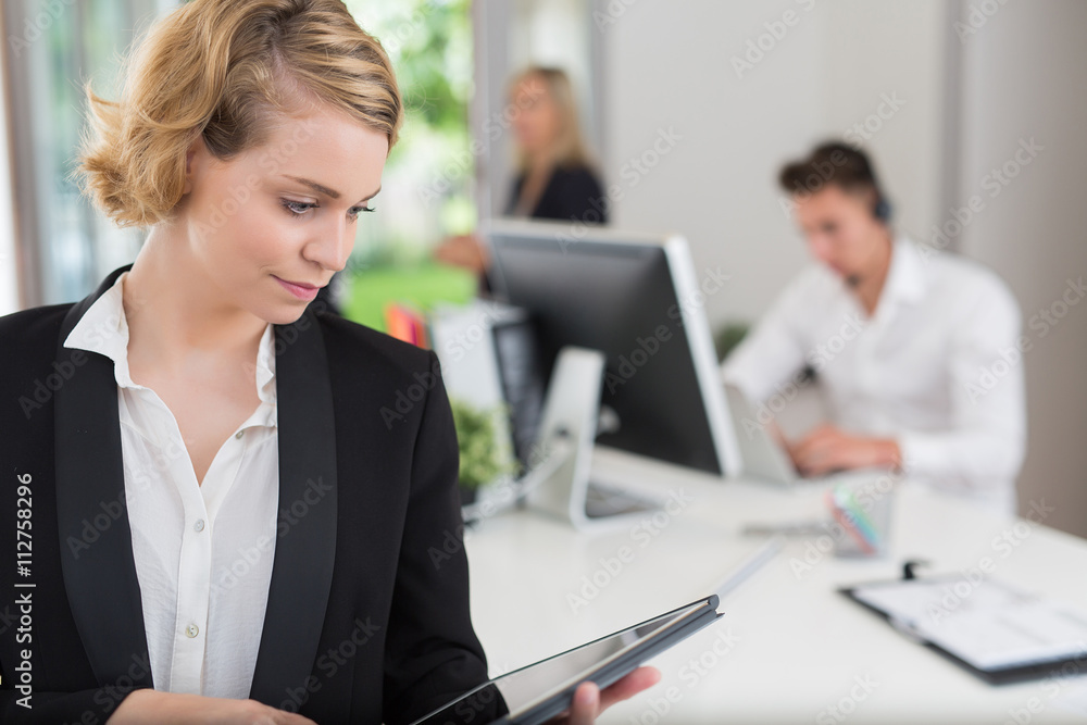 business woman with her staff, people group in background at office business woman with her staff, people group in background at office