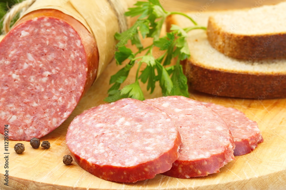 Smoked sausage with spices and greens for sandwiches