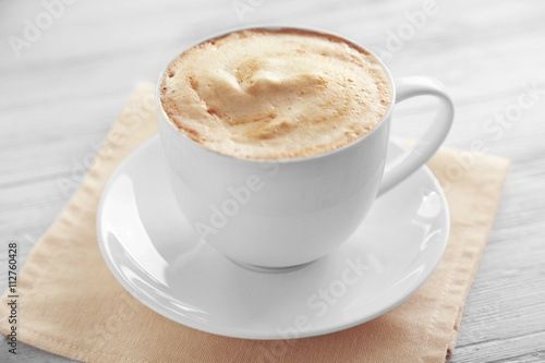 Fototapeta Naklejka Na Ścianę i Meble -  Cup of fresh coffee on napkin