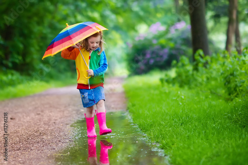 Child playing in the rain © famveldman