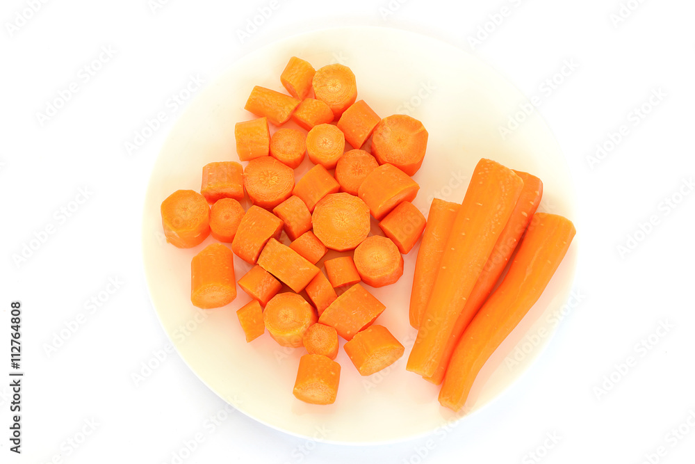 Fresh carrot on a white plate isolated on white background Fresh carrot on a white plate isolated on white background