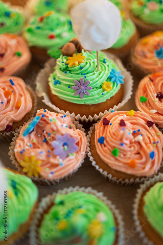 Multiple pastel colored cupcakes © mikola249