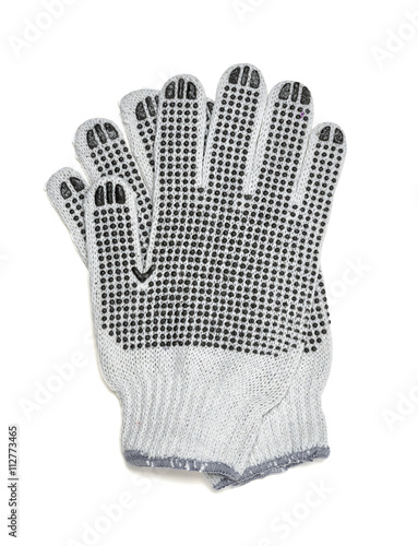 Cut-out pair of white knitted gloves with rubber-covered side