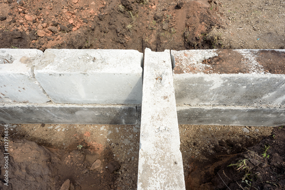 Fototapeta premium Concrete Building Block House Foundations in Earth