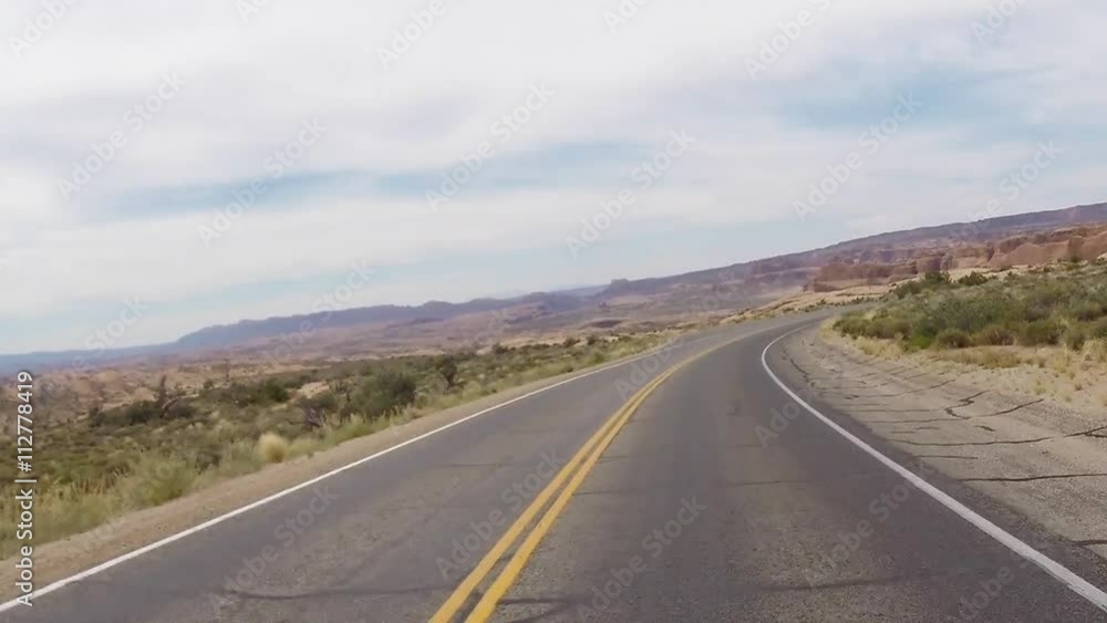 Arches Desert Road driving through the desert Arches Desert Road driving through the desert