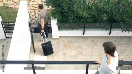 Couple break up, man going away with suitcase, super slow motion
