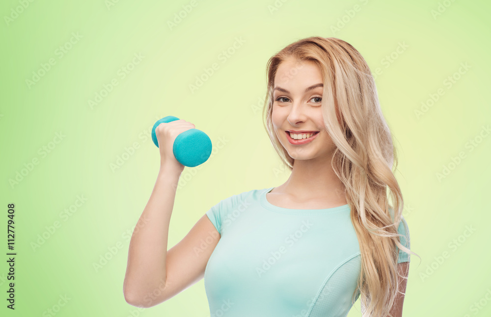 smiling beautiful young sporty woman with dumbbell smiling beautiful young sporty woman with dumbbell