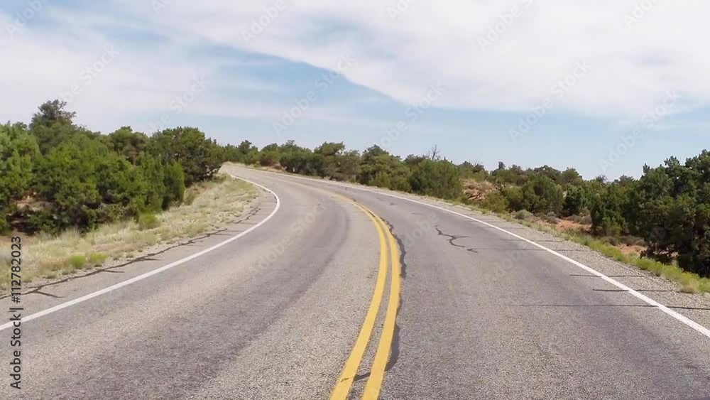 Canyonlands 2: Driving uphill through the wide open desert Canyonlands 2: Driving uphill through the wide open desert