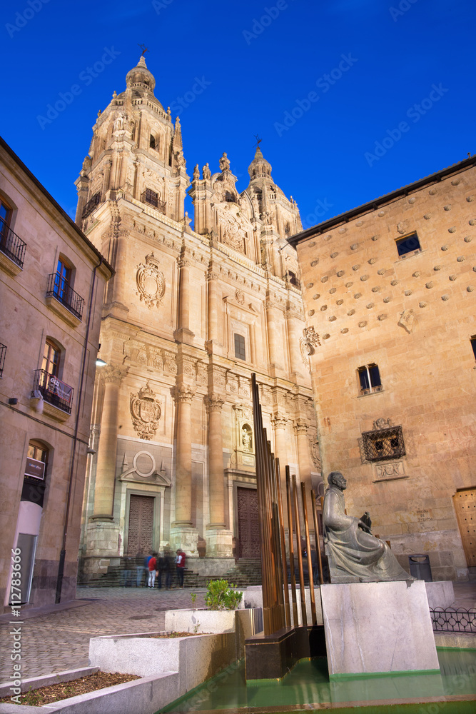 Salamanca - The baroque portal La Clerecia - Pontifical University at dusk, Casa de las Conchas and the memorial of Maestro Francisco Salinas.