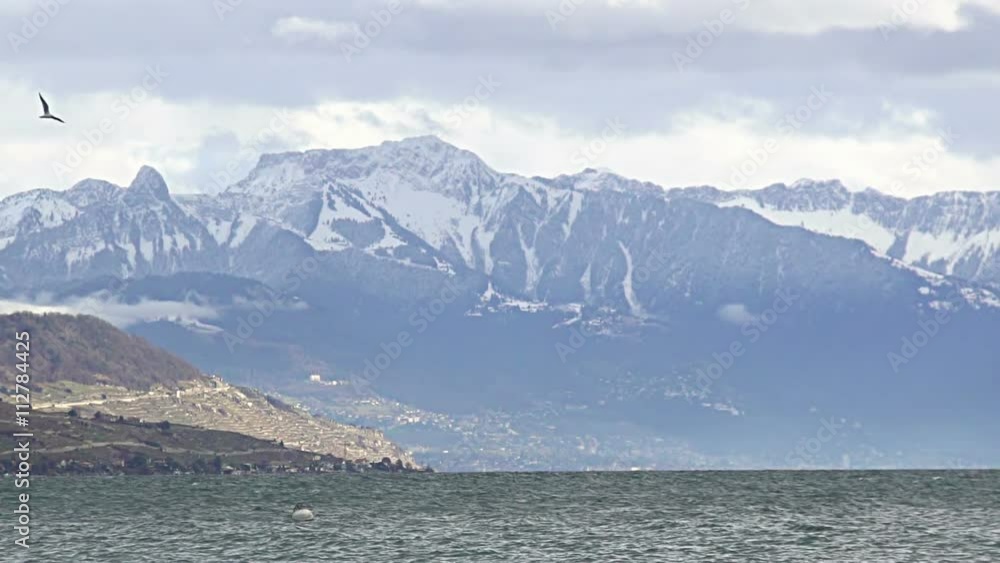 Beautiful winter landscape of Lake Geneva and Swiss Alps with glacier on peaks Beautiful winter landscape of Lake Geneva and Swiss Alps with glacier on peaks