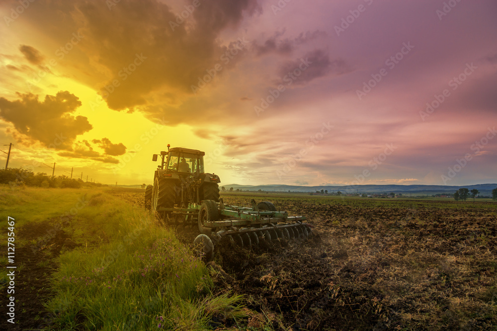 Fototapeta premium Tractor plowing