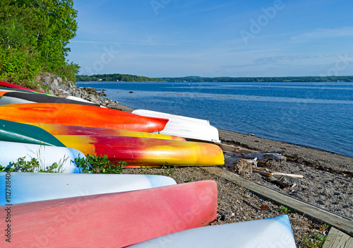 Fotografering Kayaks and canoes on beach at Northport Maine