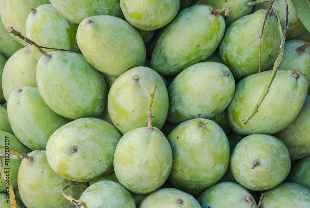 Raw mangoes sold on market stalls Chong Chom border.Raw mangoes.Green mangoes.Many Mango Raw mangoes sold on market stalls Chong Chom border.Raw mangoes.Green mangoes.Many Mango