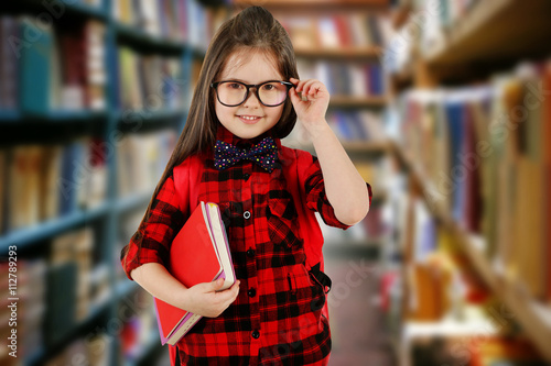 Girl with books in school l...