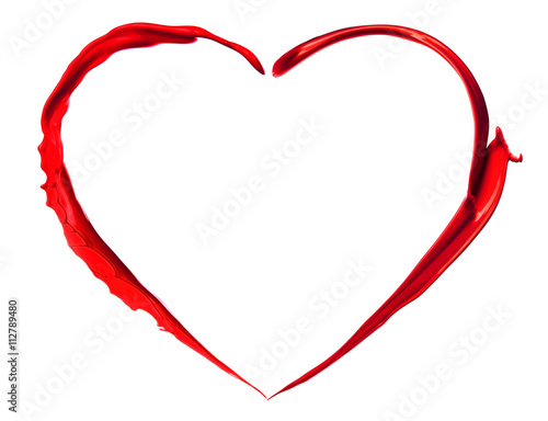 Red heart made of paint splash isolated on white