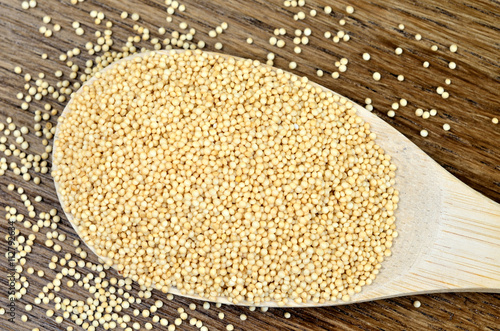 Amaranth seeds in wooden spoon photo