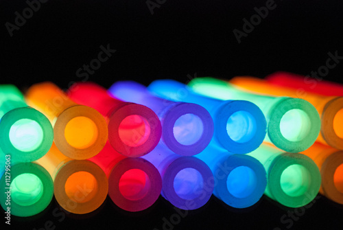 COLORFUL GLOWSTICKS IN A ROW