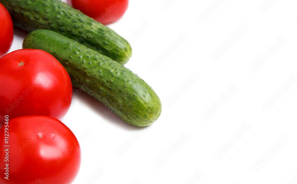 Fresh vegetables isolated on a white background. tomato and cucumber. close up. horizontal Fresh vegetables isolated on a white background. tomato and cucumber. close up. horizontal