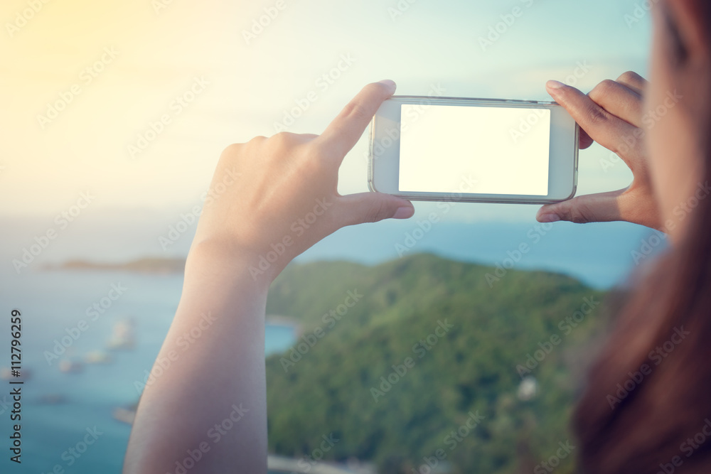 asian woman using smart phone take a photo at koh larn island  i