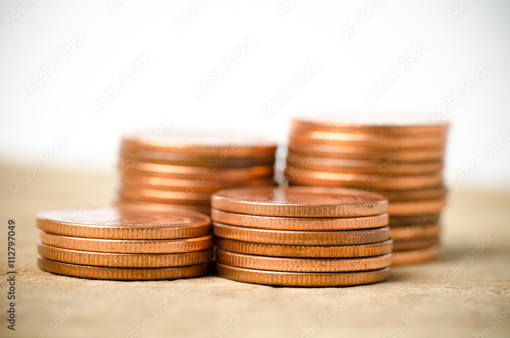 Stack of coins on wooden background,money concept Stack of coins on wooden background,money concept