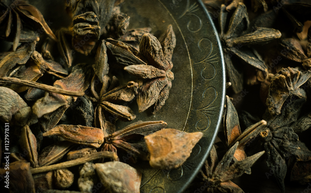 Spices. Anise stars photo. Intentionally blurred lens focus effect. Color toning. Spices. Anise stars photo. Intentionally blurred lens focus effect. Color toning.