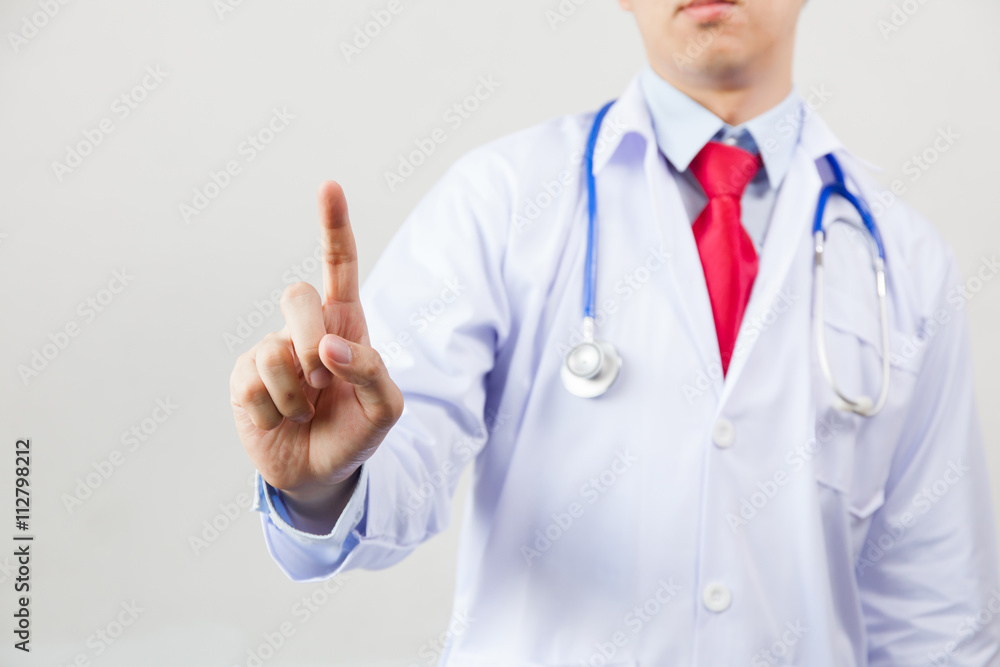 Medical doctor using one finger for pressing virtual touch screen on white isolated background Medical doctor using one finger for pressing virtual touch screen on white isolated background
