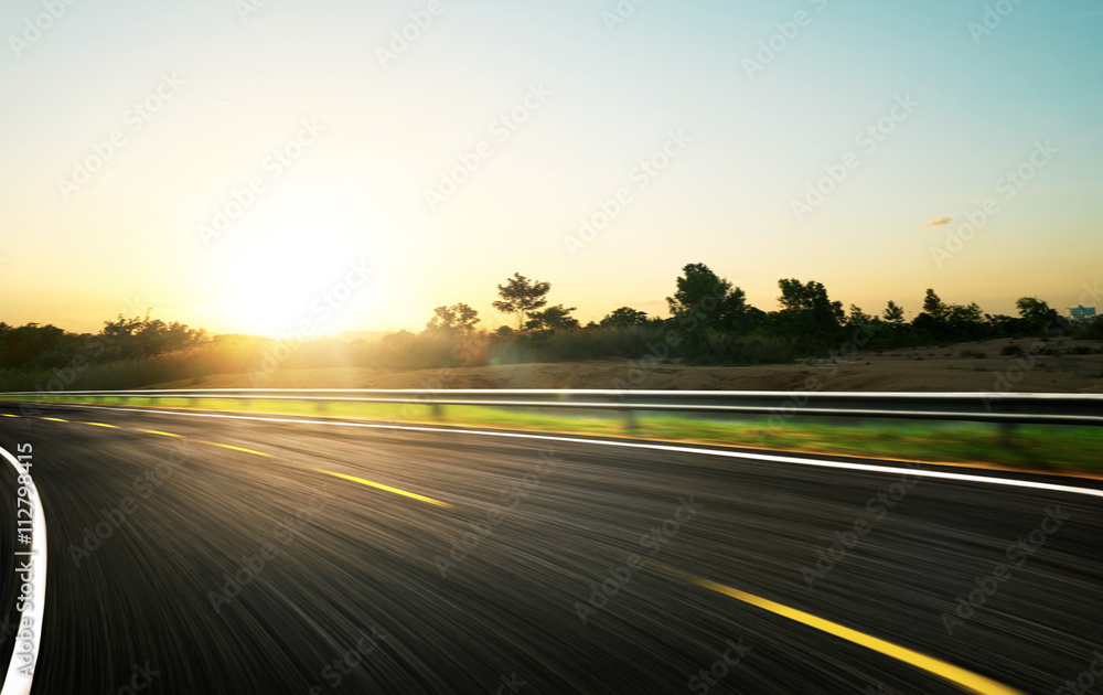 freeway at sunrise, motion blur