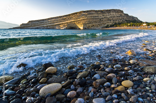 Scenic look of Matala beach and it's famous rock with a lot of caves used by hippies in '60s and '70s photo