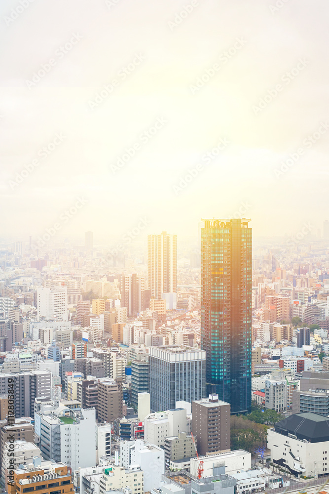 Obraz premium Business concept for real estate and corporate construction - panoramic modern city skyline bird eye aerial view with dramatic sunrise and morning sky in Osaka, Japan