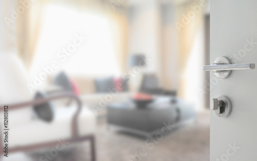 opened white door to modern living room interior © worldwide_stock