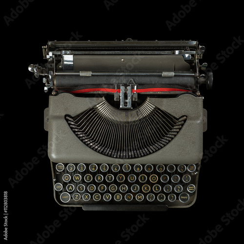 vintage typewriter isolated on black background