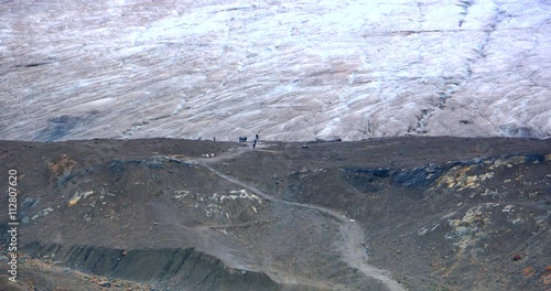 4K People Walking on Glacier Icefield, Extreme Telephoto Zoom Shot