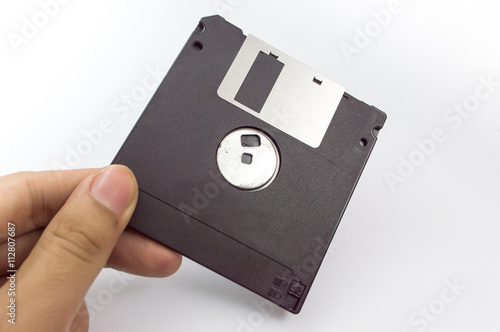 floppy disk in hand isolated on white background.