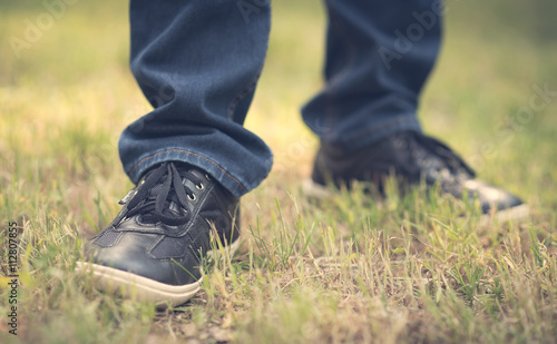 Male shoes in the green grass